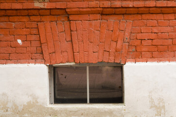 Old brick wall with window