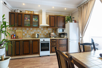 Classic wood grain kitchen set and dining table in the interior of the kitchen