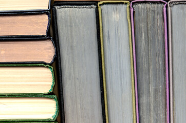 stack of colorful books in a library