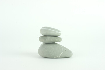 Zen stack of three grey rocks