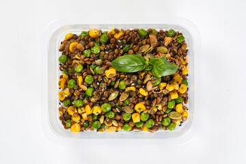 Buckwheat with beans - corn and peas in a lunch box. Healthy lunch to go