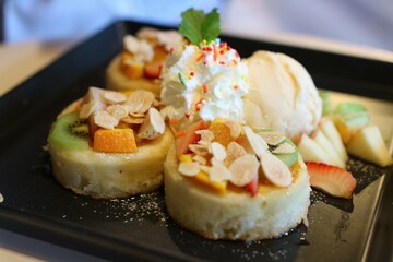 Close-up, pancake dessert with ice cream, mixed fruit, delicious dessert Selectable focus