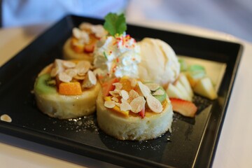 Close-up, pancake dessert with ice cream, mixed fruit, delicious dessert Selectable focus