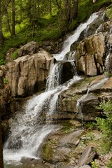 Fototapeta na wymiar waterfall in the mountains, motion blur.
