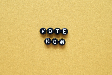 Presidental election day lettering. 2020 quote. American vote banner. Black color round phrase. Vote now slogan. Golden background