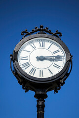 Fototapeta na wymiar Vintage clock in Victory square from Timisoara, Romania.