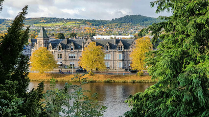 Houses by the river in Autumn colours