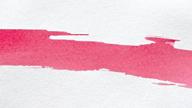 Verschiedene,rote Aquarell Pinselstriche auf Papier. Makro Aufnahme