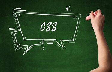 Hand drawing CSS abbreviation with white chalk on blackboard
