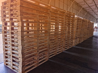 Wooden pallets stack in warehouse cargo storage, shipment in logistics and transportation industrial, wood pallets heap, delivery service