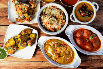 Assorted indian food on wooden background. Dishes and appetizers of indian cuisine