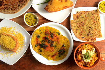 Assorted indian food on wooden background. Dishes and appetizers of indian cuisine
