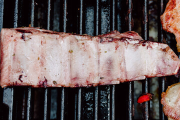 Selective focus. Pork rib in a barbecue. Food. Life Style.