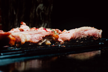 Selective focus. Skewer of chicken with pieces of red and green peppers, pork rib in a barbecue. Food. Life Style.
