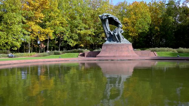 Polish composer Fryderyk Chopin sculpture in Lazienki Krolweskie, Royal Baths Park in Warsaw city, Poland, 4k