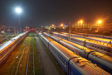 Fototapeta na wymiar Brest, Belarus - October 22, 2020 - Large railway transshipment point. Trains prepare to depart at night