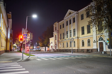 Fototapeta na wymiar Brest, Belarus - October 22, 2020 - Clean empty street at night. Small town Brest in Belarus