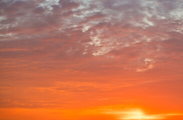 Naklejka na ściany i meble Colors of the beautiful orange sunset (sky background)