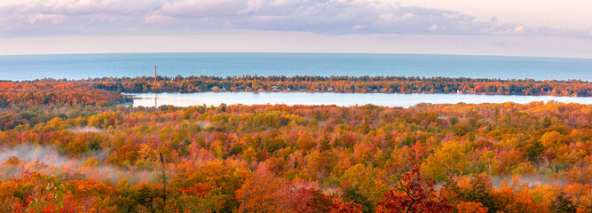 Panoramic view  of carpet of autumn trees around the  lake independence, view from Thomas rock overlook in Michigan upper peninsula.