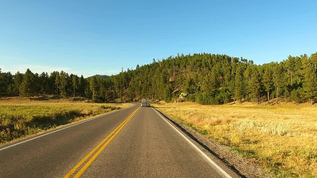Following horse trailer Black Hills of South Dakota POV 4K. Black Hills of South Dakota. Mountain, valley, landscape scenic discovery. State Park with wildlife, lakes, campgrounds and picnic areas.