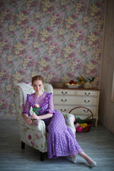 Fototapeta premium beautiful red-haired girl in vintage dress