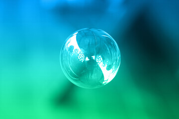 1 soap bubble on a green and blue background