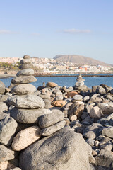 Fototapeta na wymiar Stones balanced on a beach in Costa Adeje, Tenerife