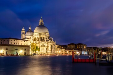 Fototapeta na wymiar The Basilica of St Mary of Health or Basilica di Santa Maria della Salute at grand canal at night in Venice, Italy
