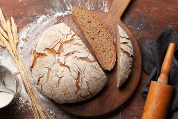 Homemade baked bread on wooden table