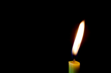 Candle flame on a black background.