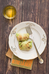 Vegan cabbage stuffed rolls on a dark background