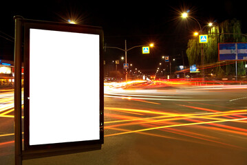 Blank signboard on the background of the night city. Mockup for design. Free space for advertising....