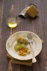 Vegan cabbage stuffed rolls on a dark background