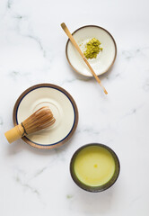 Green tea matcha latte cup from above flat. 