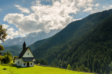 Beautiful view of church and famous dolomite mountain, Italy.