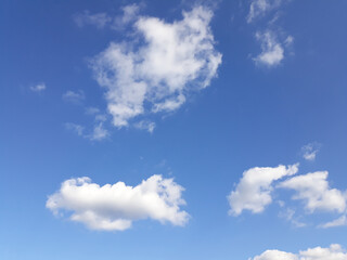 Obraz na płótnie Canvas White clouds on a blue sky. Background.