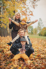 Family make people pyramid. leaf fall, lifestyle. Autumn season.