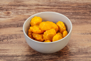 Marinated yellow patisson in the bowl