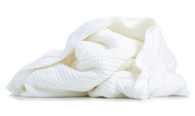 Fototapeta na wymiar White warm knitted blanket on white background isolation
