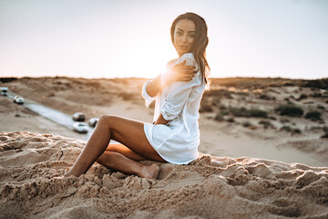 moroccan girl in the dunes of the south of spain and beach coast white tarifa bolonia