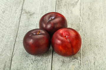 Ripe sweet plum fruit heap