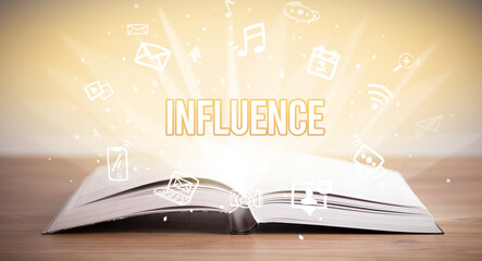 Opeen book with INFLUENCE inscription, business concept