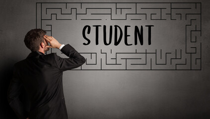 businessman drawing maze with STUDENT inscription, business education concept