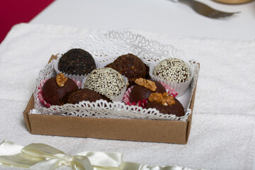 Cardboard packaging with dried fruit and nuts sweets. Made at home in self-isolation during the epidemic.