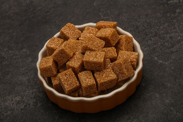 Cane sugar cubs in the bowl