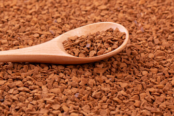 Instant coffee. Granular coffee in a spoon close-up.