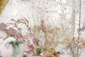 Florist equipment with flowers on wooden background
