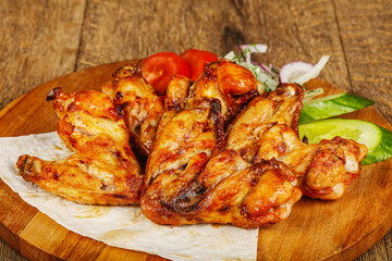 Chicken wings barbeque vith vegetables