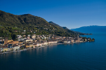 Fototapeta na wymiar Panoramic view of the historic part of Salò on Lake Garda Italy. Aerial view of the town on Lake Garda. Lake in the mountains of Italy. Tourist site on Lake Garda.