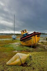 Wreck boat at low tide in Brittany. France
